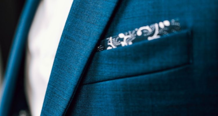 person in green suit jacket